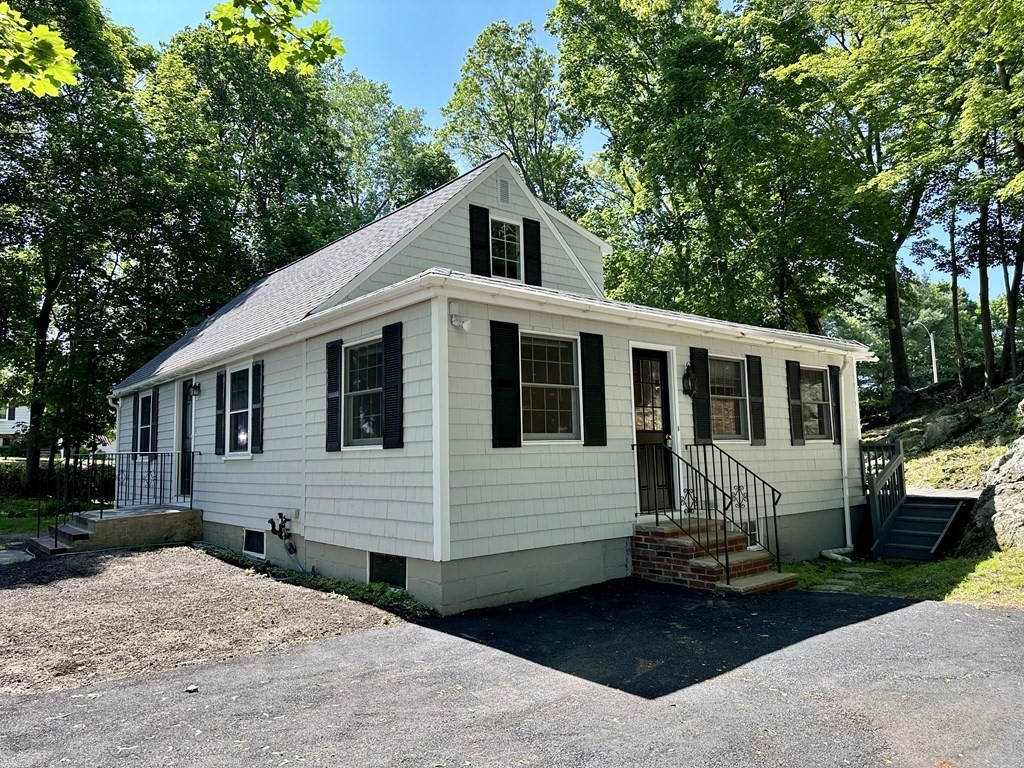 165 R Green Street Stoneham, MA 02180 - Photo 4 of 42 a front view of a house with a yard