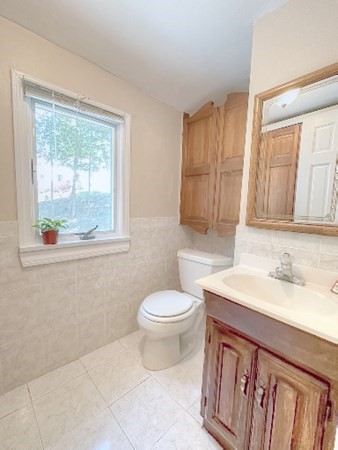 165 R Green Street Stoneham, MA 02180 - Photo 42 of 42 a bathroom with a sink a toilet and tub