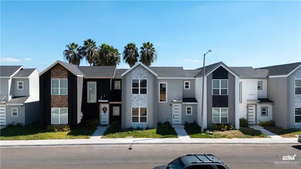 a front view of a house with yard