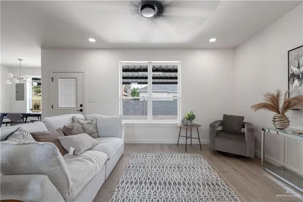 a living room with furniture and a window