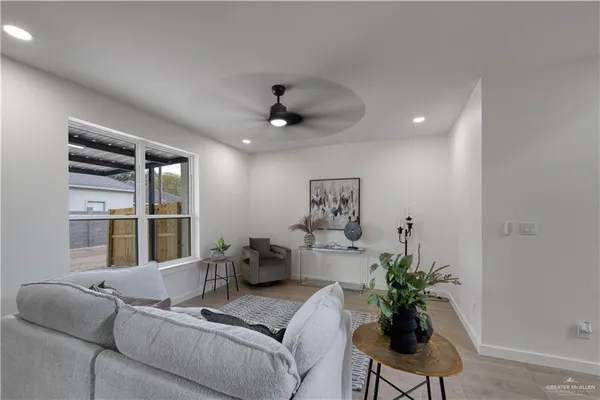 a living room with furniture and a large window