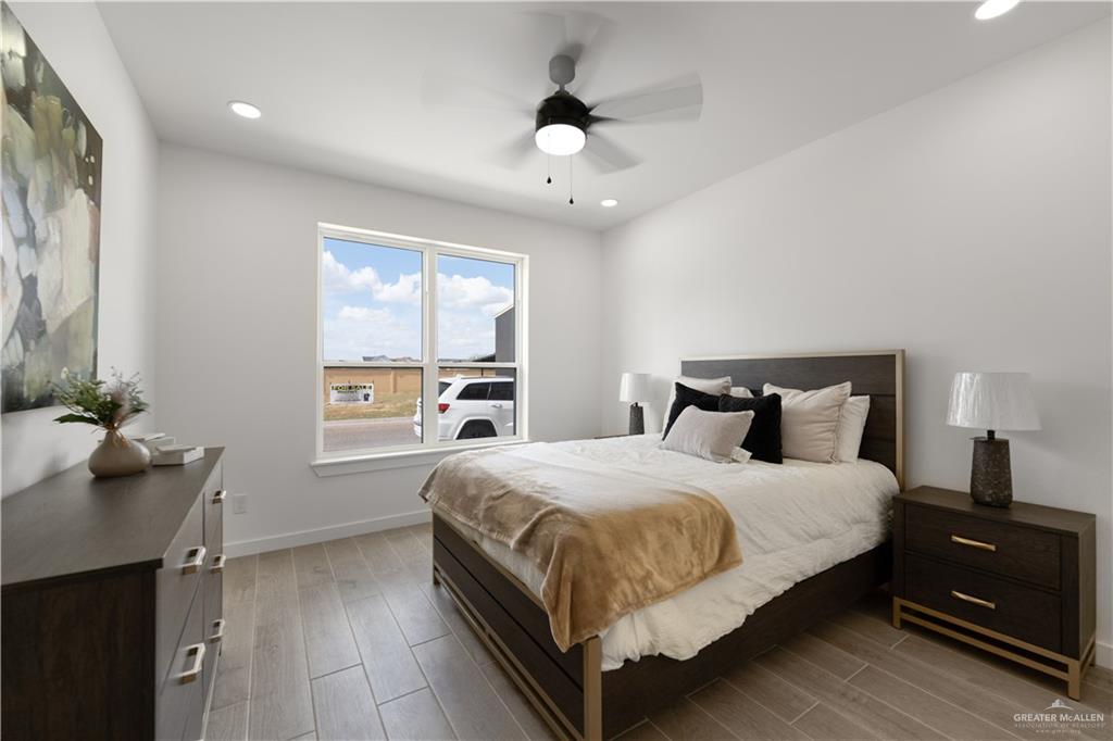 5408 North Crown Point Pharr, TX 78577 - Photo 9 of 19 a bedroom with a bed and a table