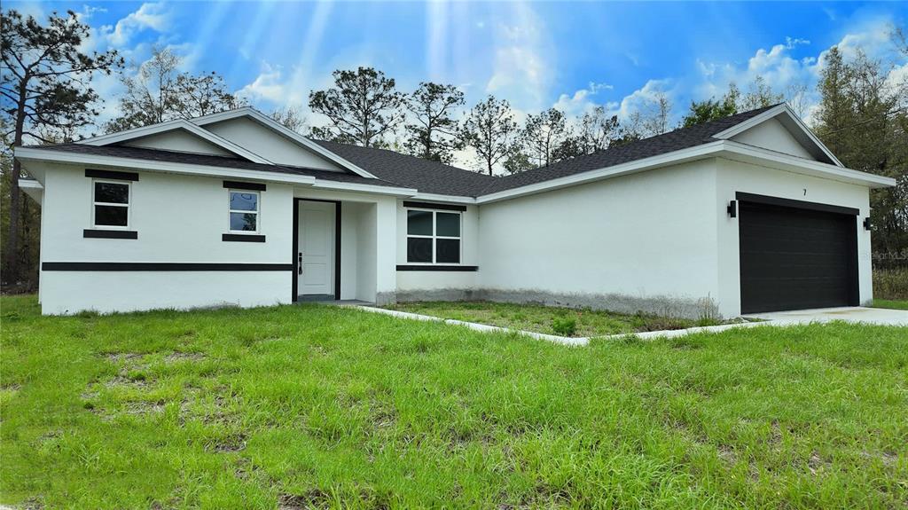 7 Spring Pass Ocala, FL 34472 - Photo 3 of 35 a view of backyard of house with green space