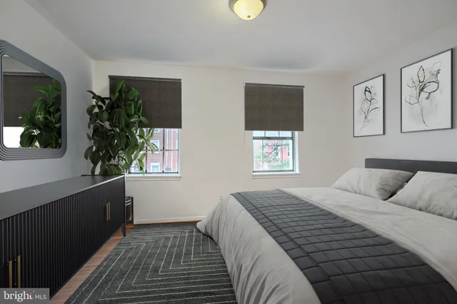 a bedroom with a large bed and a window