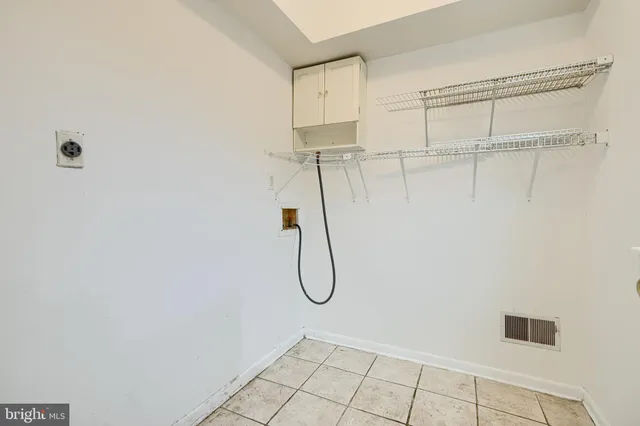 a picture of a bench in front of a wall