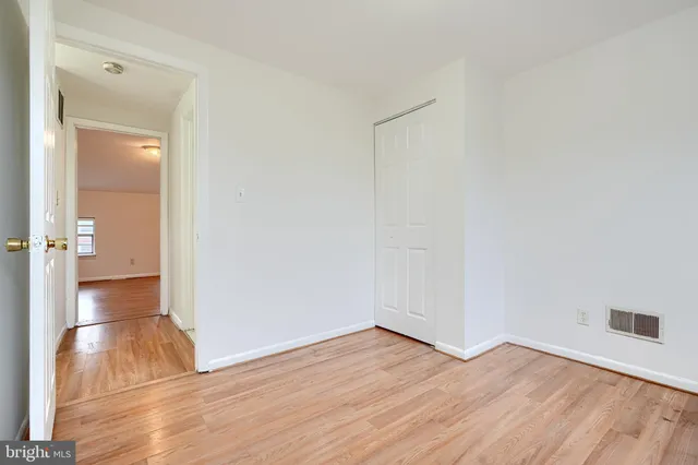 a bathroom with a sink toilet and mirror