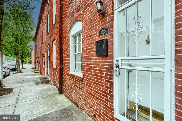a view of a brick buildings with entryway doors