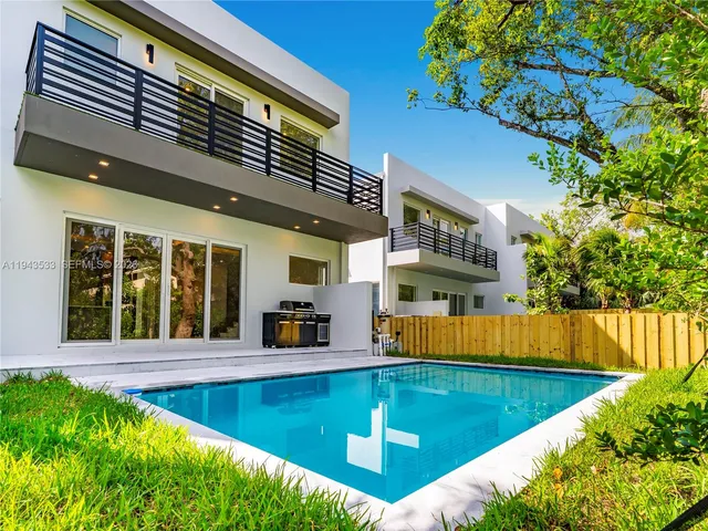 a view of swimming pool with a lounge chairs