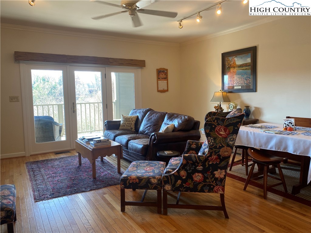 148 North Ridge Circle, Unit B Boone, NC 28607 - Photo 13 of 36 a living room with furniture a wooden floor and a window