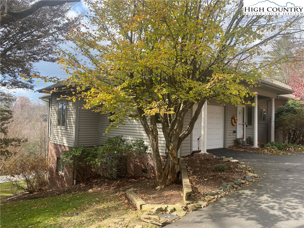 148 North Ridge Circle, Unit B Boone, NC 28607 - Photo 7 of 36 a front view of a house with a tree