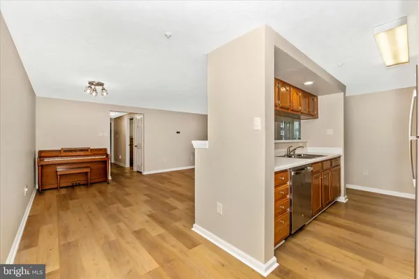 a kitchen with stainless steel appliances a stove and a refrigerator