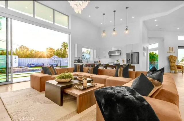 a kitchen with stainless steel appliances granite countertop a stove a refrigerator and a cabinets