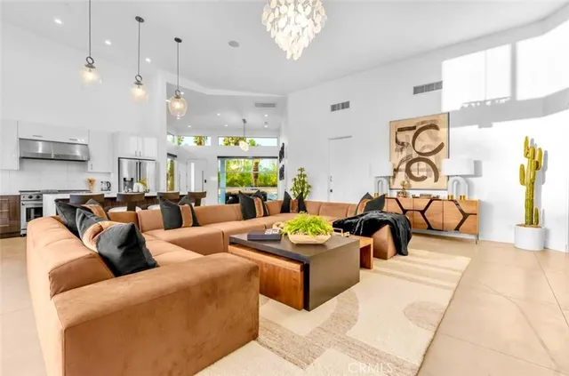 a large kitchen with a table and chairs