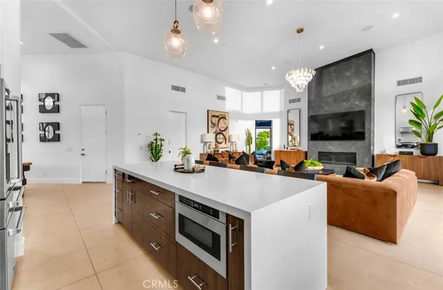 a living room with a bed furniture and a large window