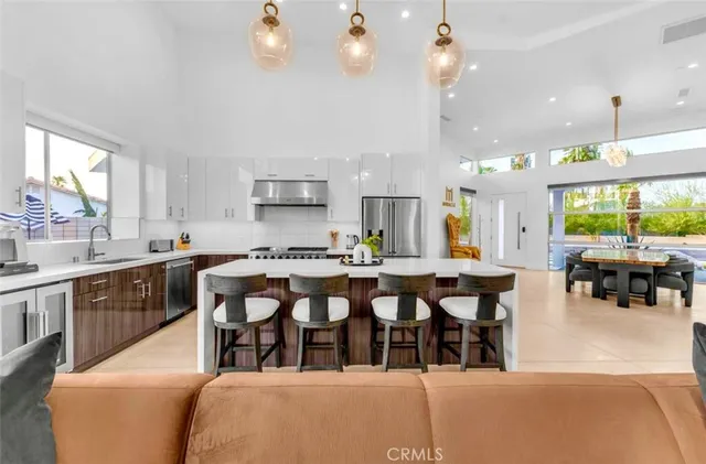 a living room with a large window and a flat screen tv