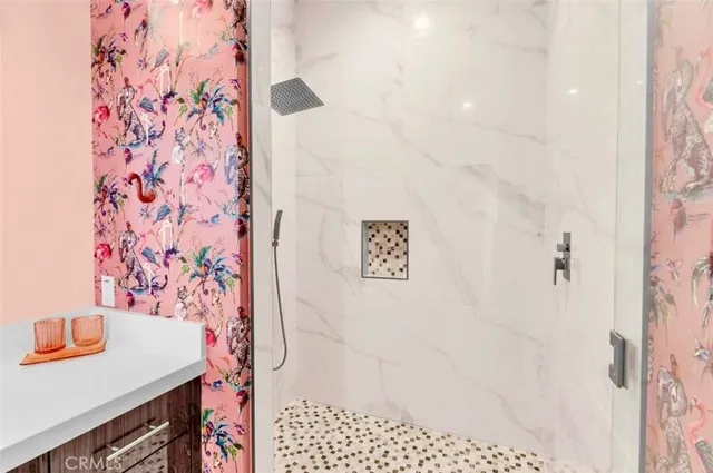 a view of a swimming pool with a lawn chairs under an umbrella