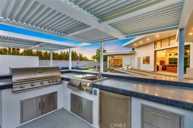 a view of outdoor space with swimming pool and seating