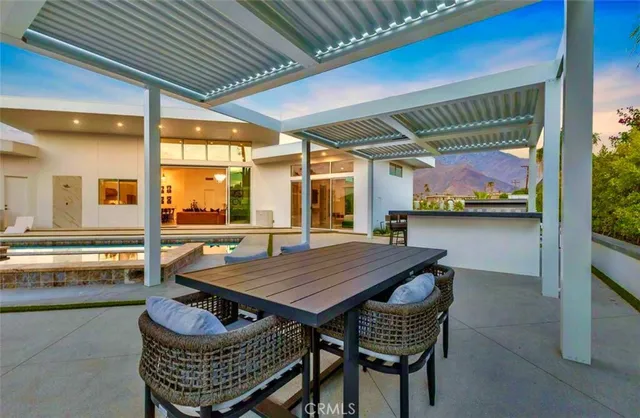 a view of a swimming pool with a lounge chairs