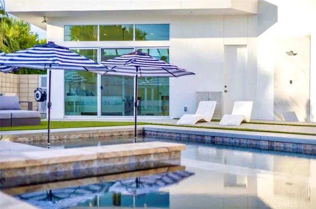 a view of a kitchen area with furniture and wooden floor