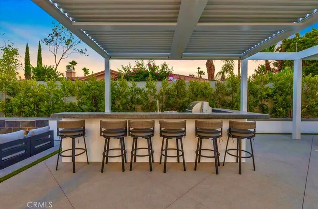 a front view of a house with a glass door and glass door