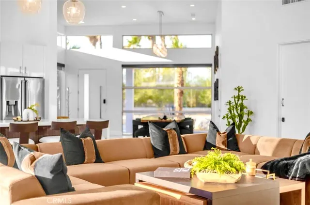 a bedroom with furniture and a flat screen tv