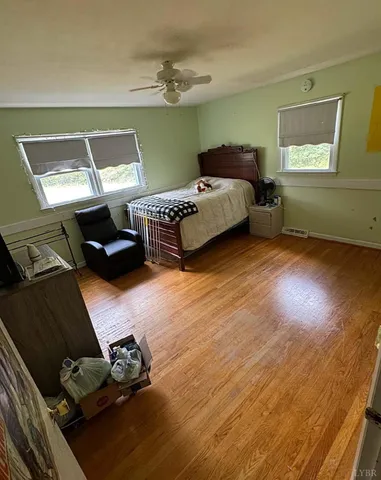 a bedroom with furniture and a window
