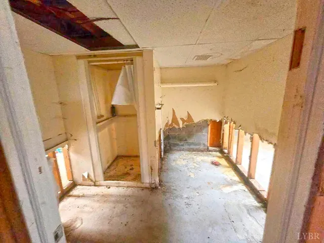 a view of a porch with a floor to ceiling window