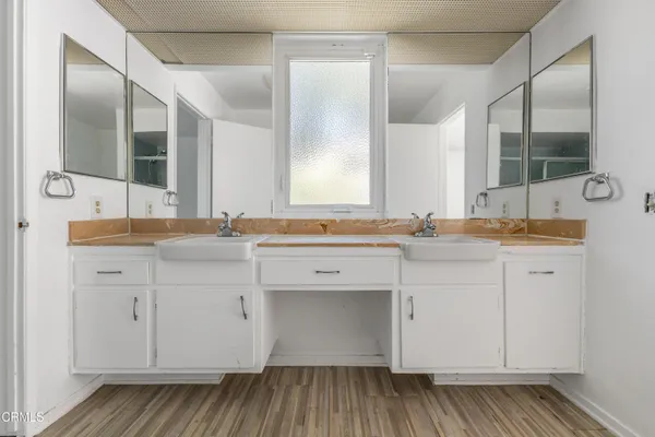 a bathroom with a sink and a mirror