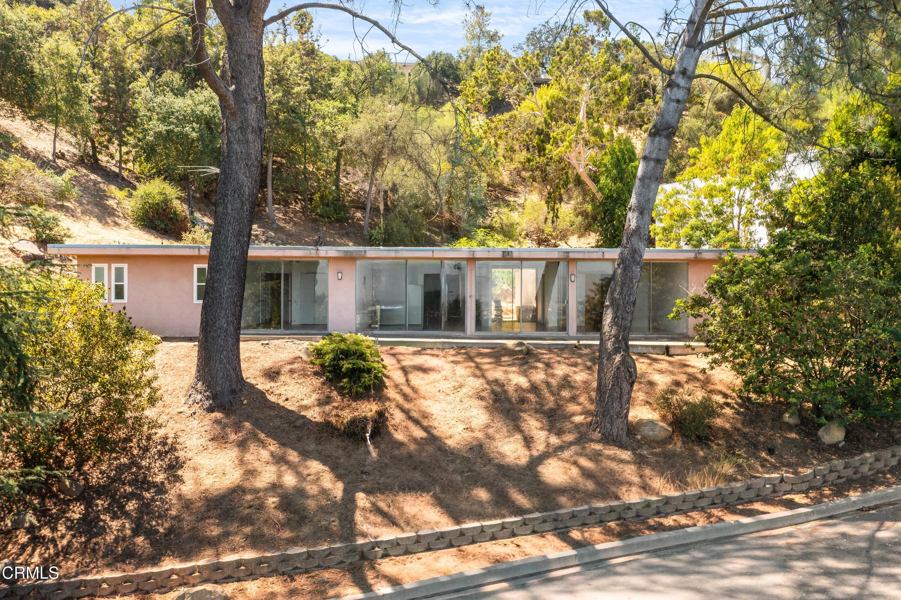 16274 Dorilee Lane Encino, CA 91436 - Photo 19 of 23 front view of a house with a yard