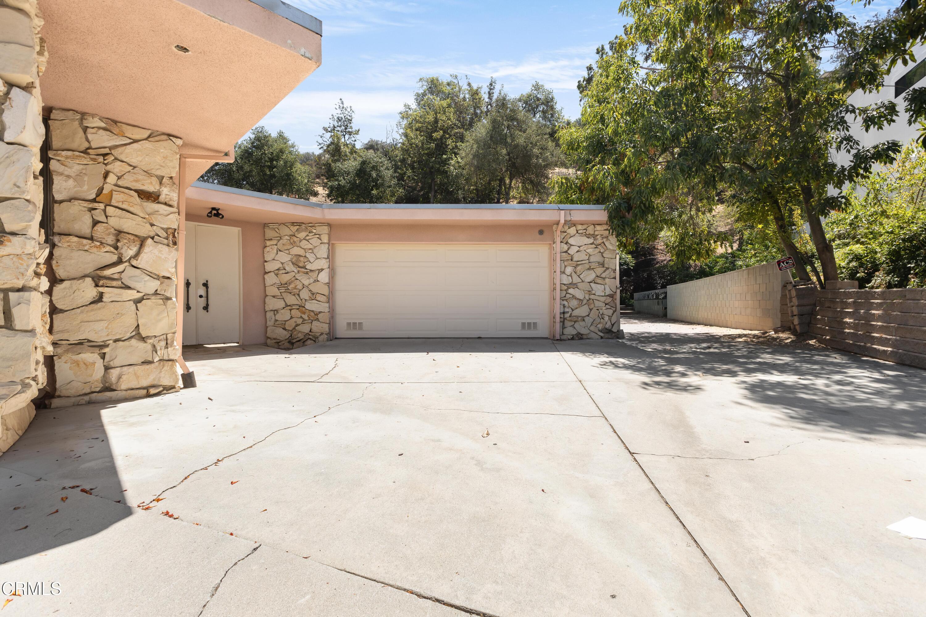 16274 Dorilee Lane Encino, CA 91436 - Photo 23 of 23 a front view of a stone house