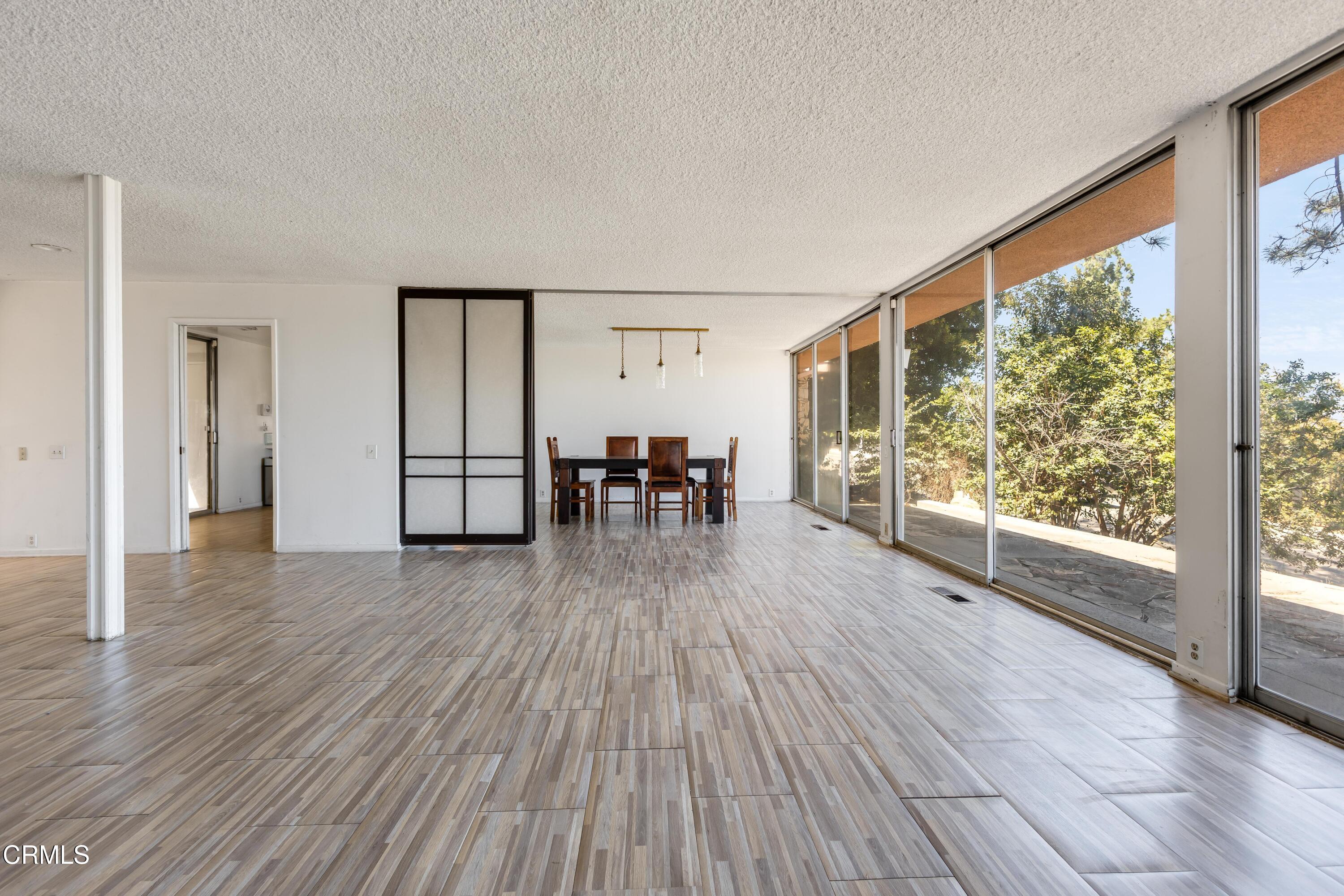 16274 Dorilee Lane Encino, CA 91436 - Photo 3 of 23 a view of a livingroom with furniture wooden floor next to a window
