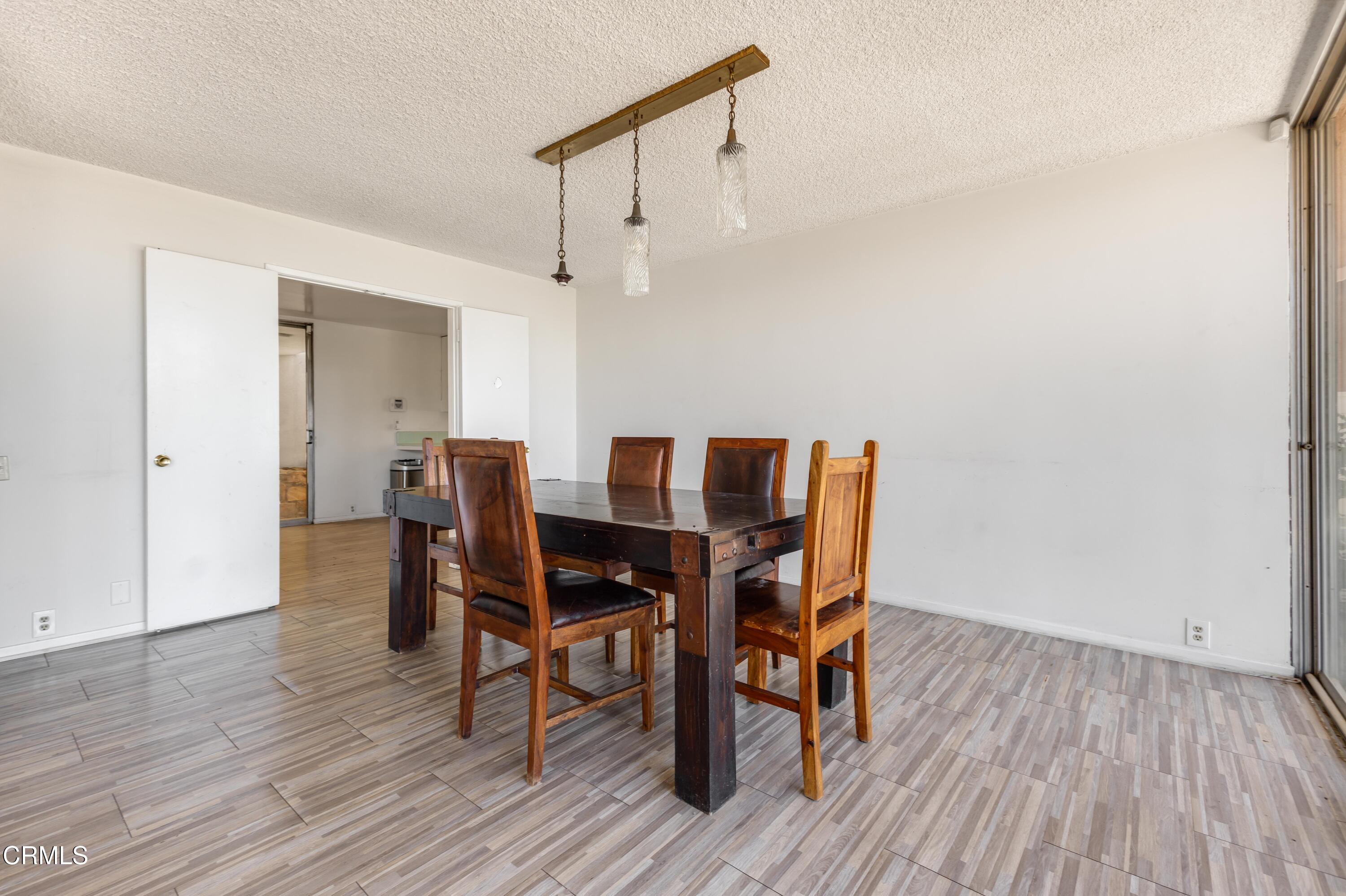 16274 Dorilee Lane Encino, CA 91436 - Photo 5 of 23 a view of a dining room with furniture and wooden floor
