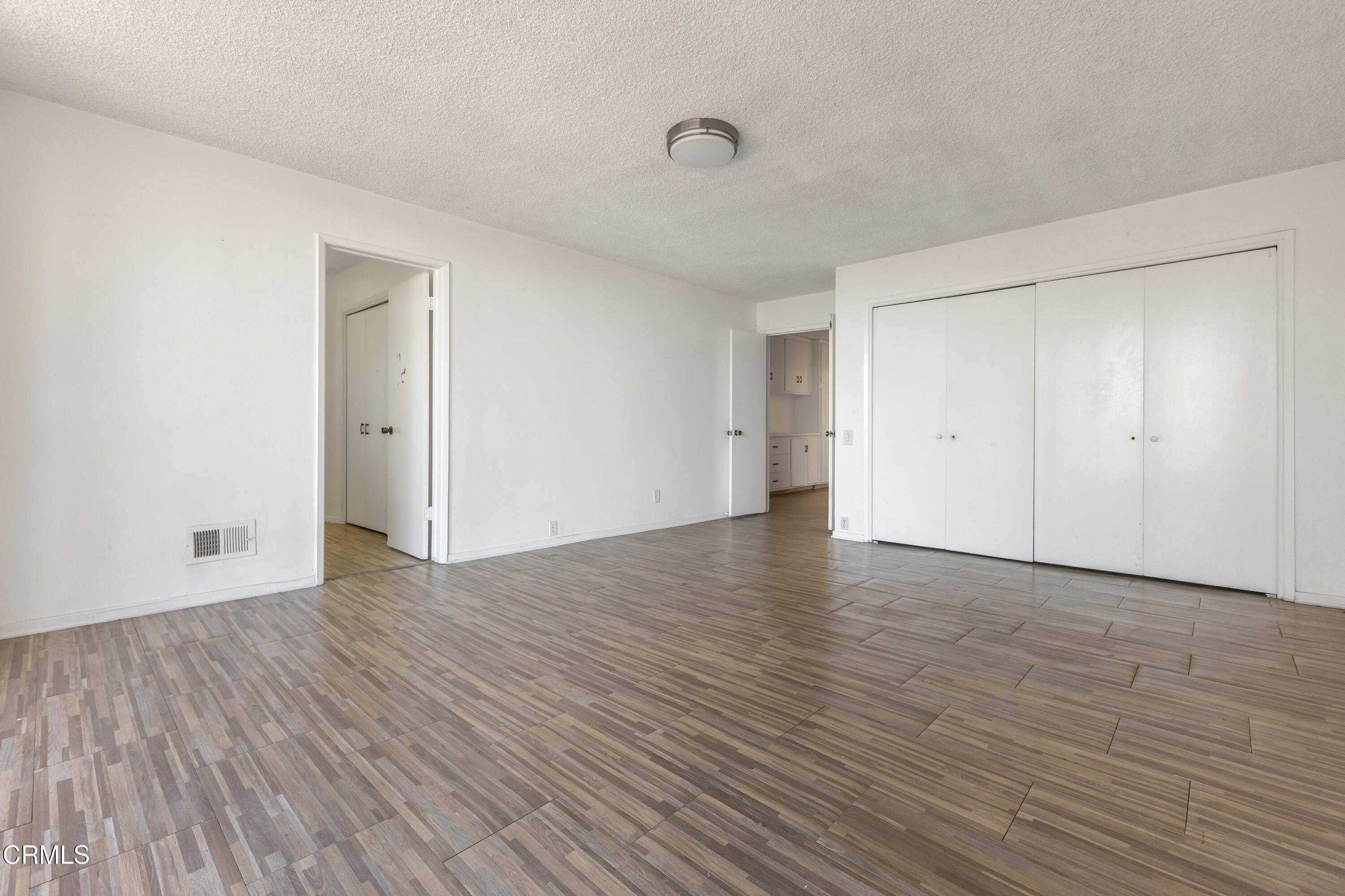 16274 Dorilee Lane Encino, CA 91436 - Photo 10 of 23 a view of an empty room with wooden floor