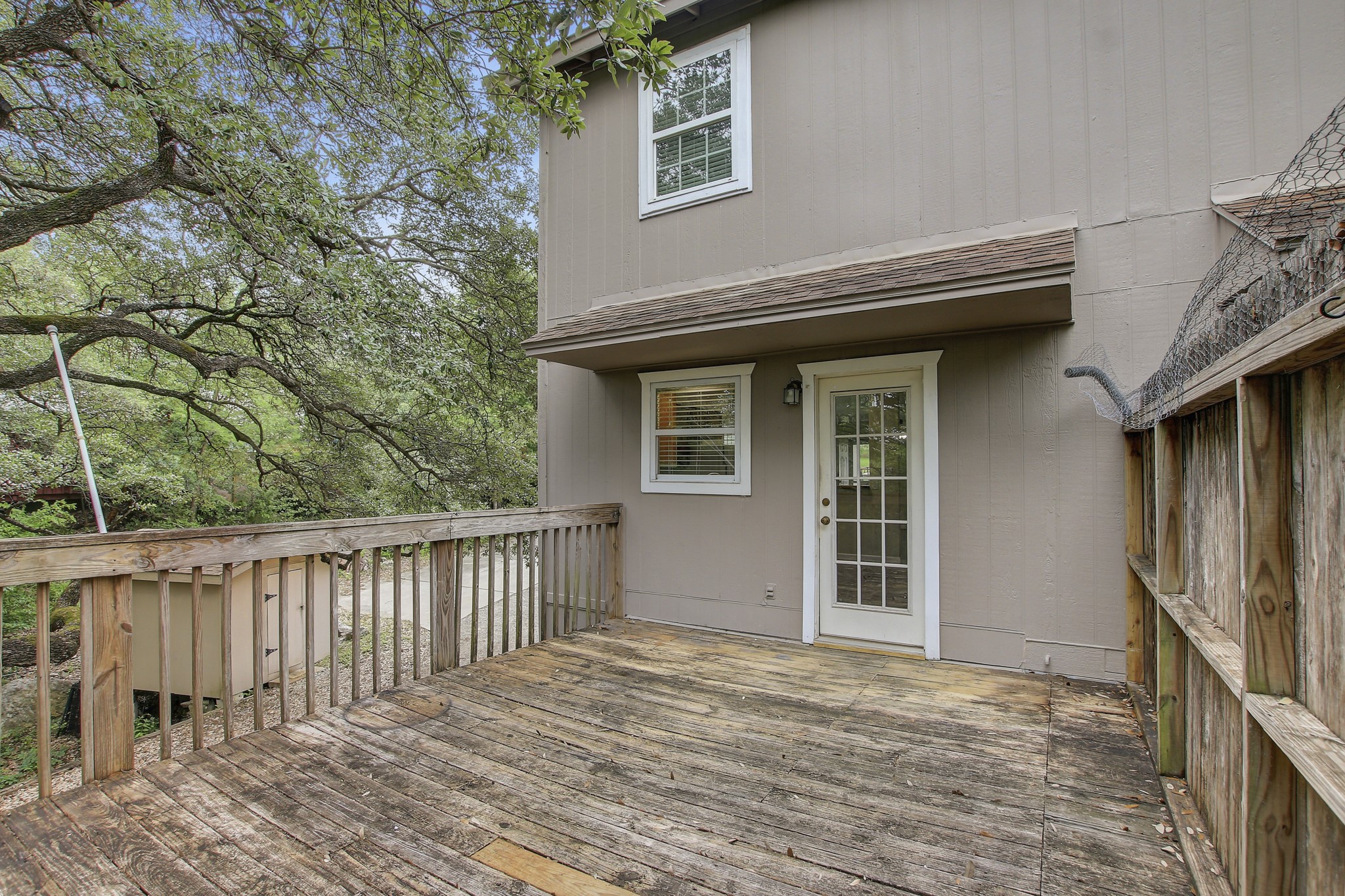 6902 Rifle Bend Austin, TX 78736 - Photo 24 of 33 a house with trees in front of it