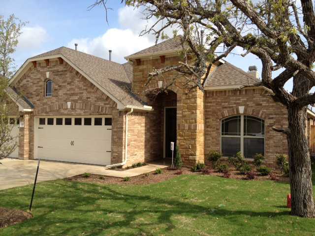 2816 Homecoming Leander, TX 78641 - Photo 1 of 1 a view of a house with a yard