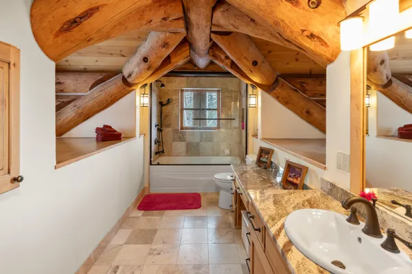 a bathroom with a sink and mirror