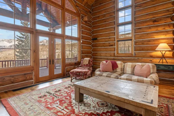 a living room with furniture and a rug