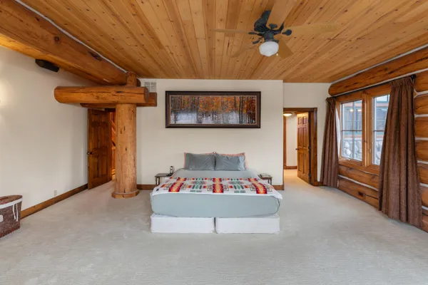 a bedroom with furniture and a chandelier