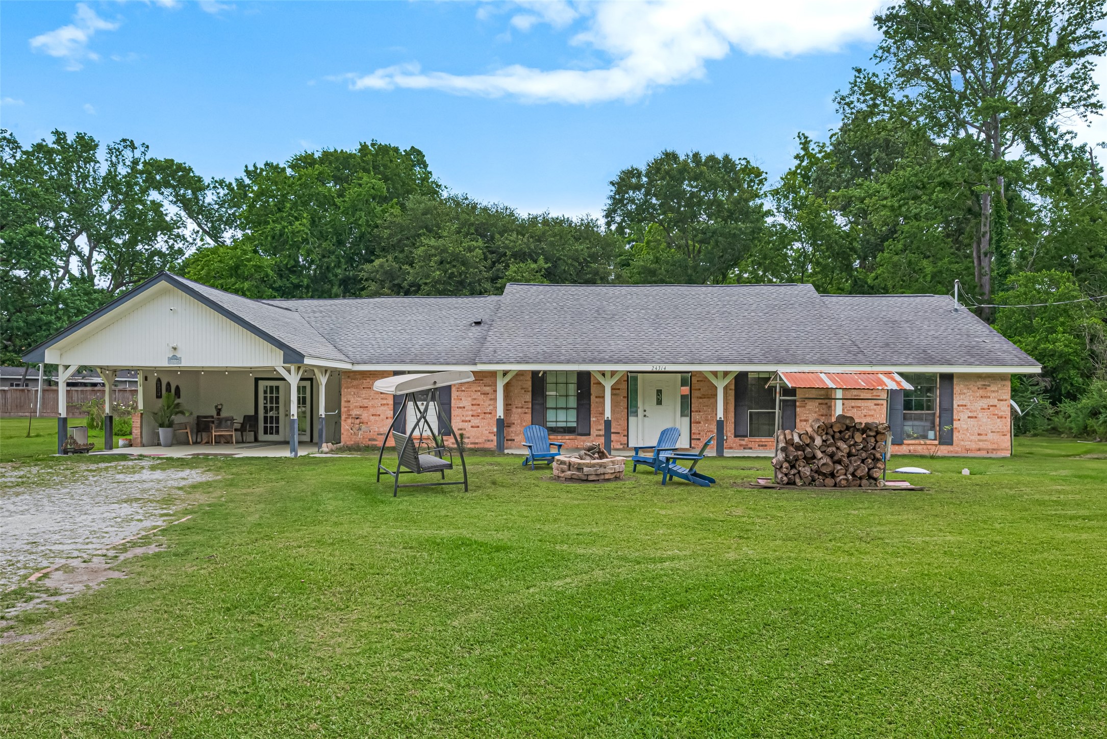 24314 Anderson Street Huffman, TX 77336 - Photo 2 of 48 a view of a house with a yard
