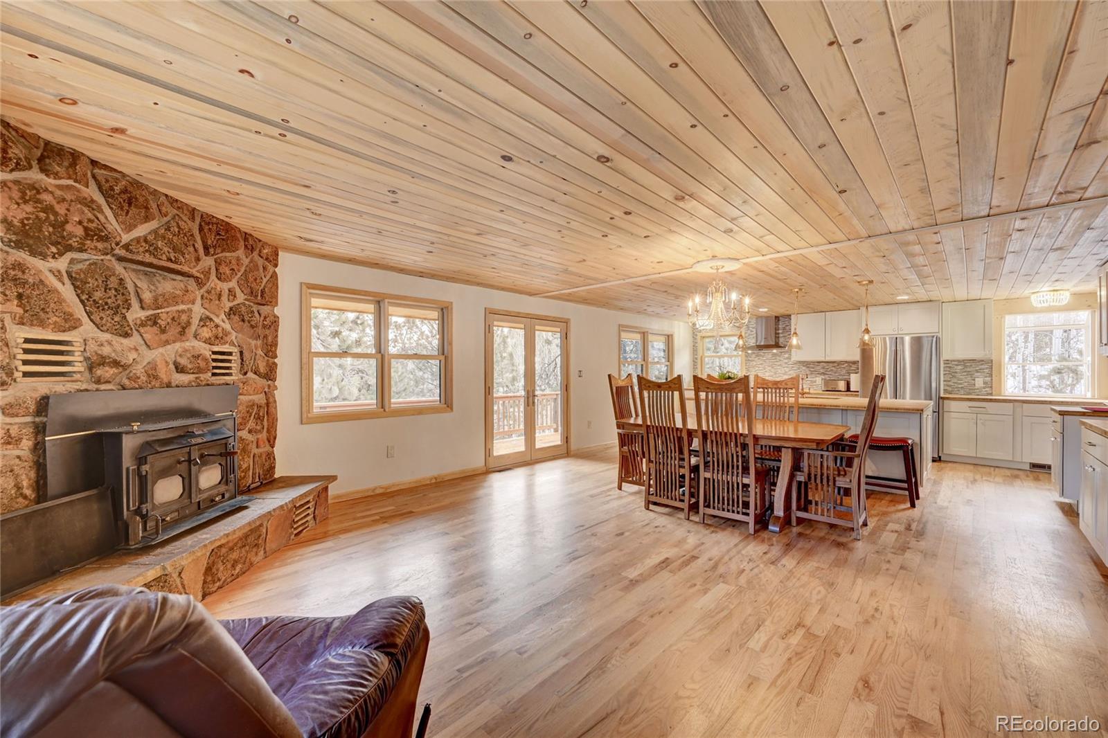 526 Rising Sun Road Bailey, CO 80421 - Photo 18 of 40 a living room with furniture and a wooden floor