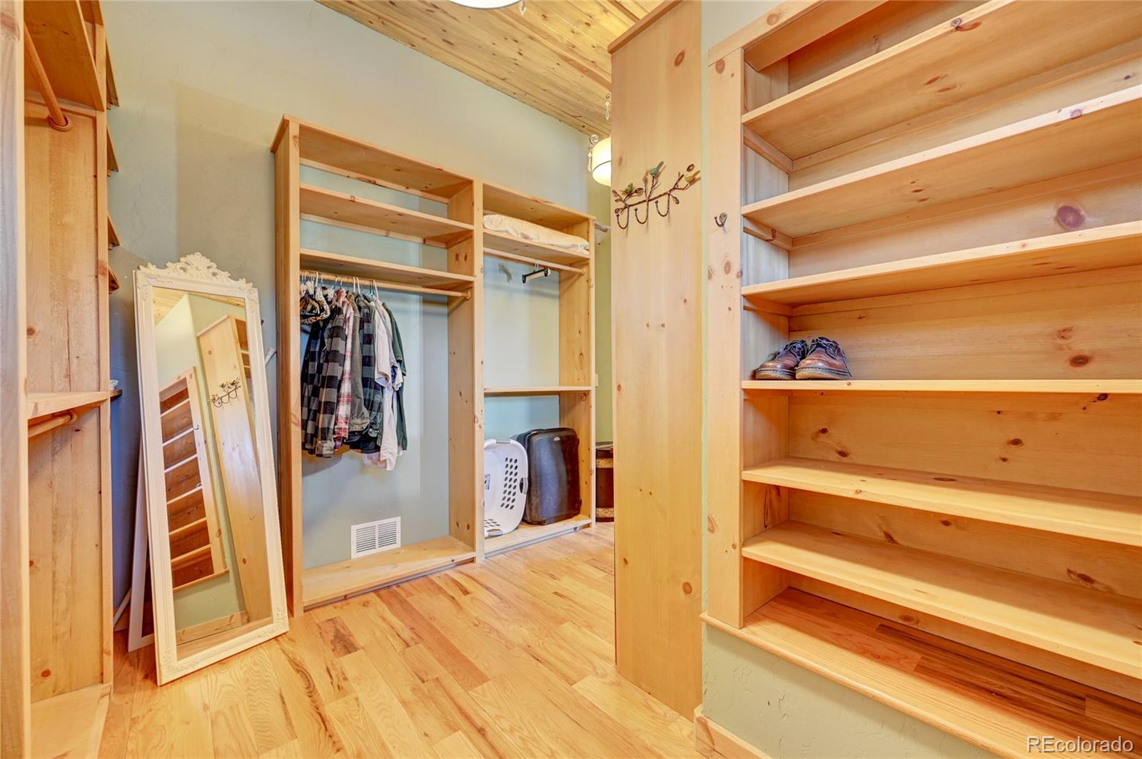526 Rising Sun Road Bailey, CO 80421 - Photo 30 of 40 a view of walk in closet with clothes and shoes
