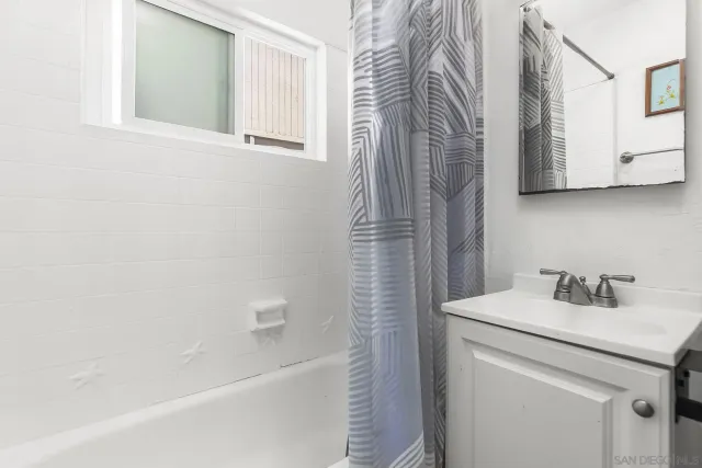 a bathroom with a sink a toilet and a bathtub