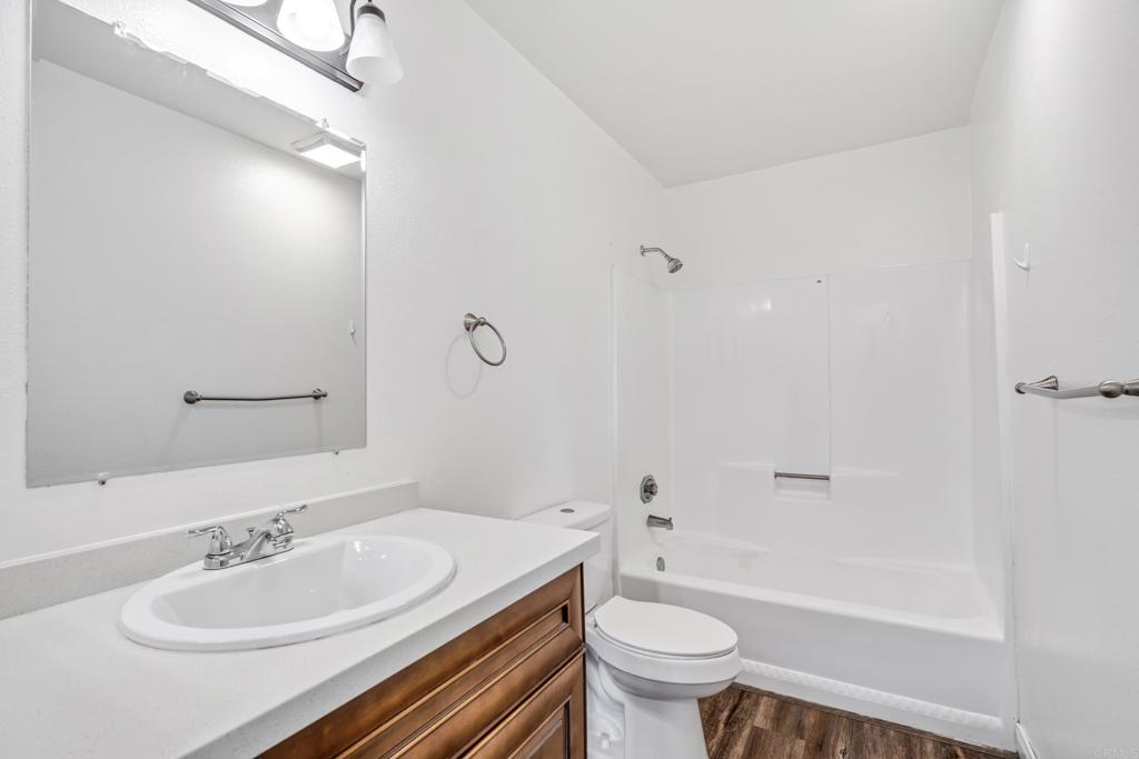 2964 Crane Street, Unit A B Lemon Grove, CA 91945 - Photo 11 of 50 a bathroom with a sink a toilet and shower