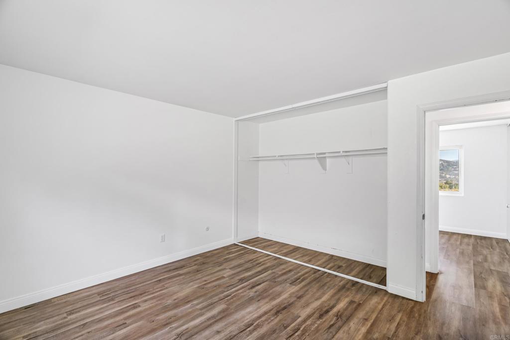 2964 Crane Street, Unit A B Lemon Grove, CA 91945 - Photo 13 of 50 an empty room with wooden floor