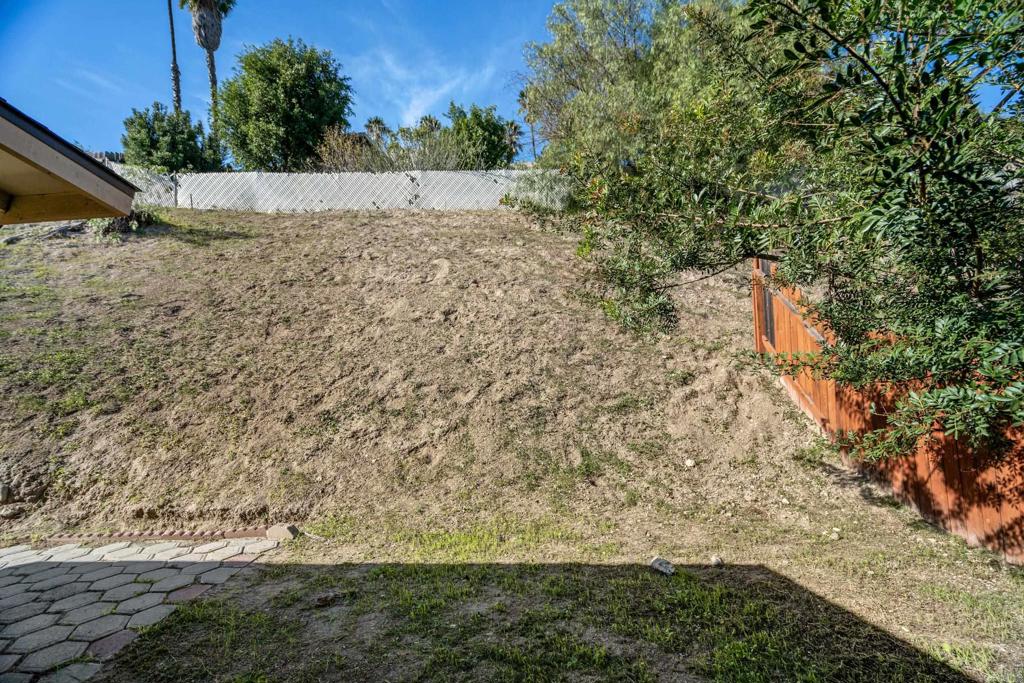 2964 Crane Street, Unit A B Lemon Grove, CA 91945 - Photo 22 of 50 a view of a yard with a tree