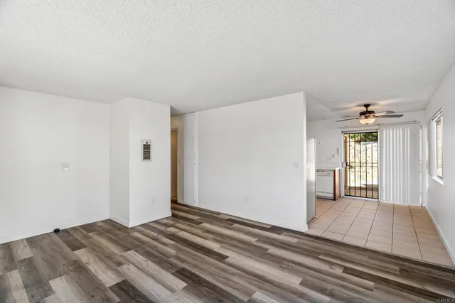 a view of a room with wooden floor