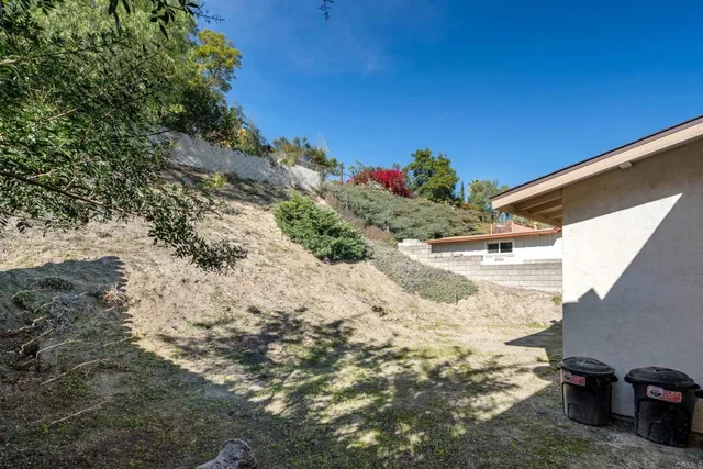 a view of a backyard of the house