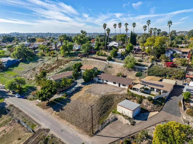 an aerial view of a house with outdoor space