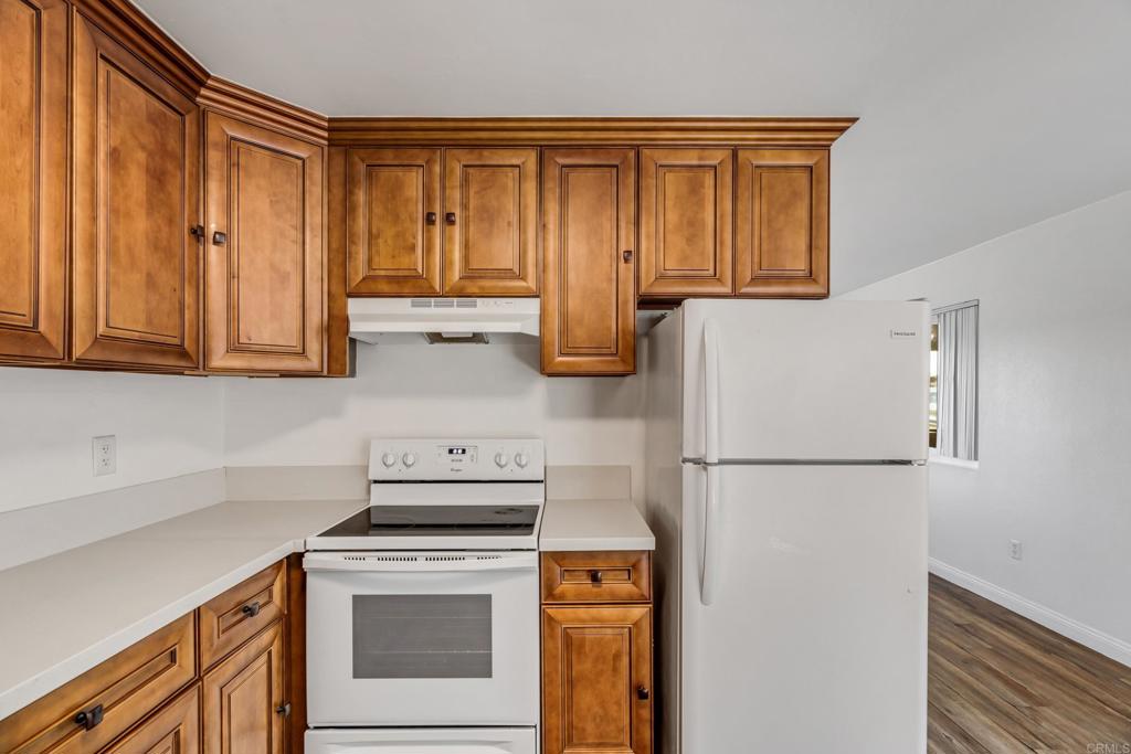 2964 Crane Street, Unit A B Lemon Grove, CA 91945 - Photo 9 of 50 a kitchen with a refrigerator sink stove and cabinets