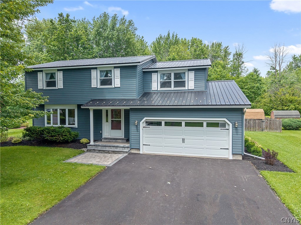 8069 Princess Path Clay, NY 13090 - Photo 43 of 50 Notice the new siding, roof, sidewalk, porch, gara